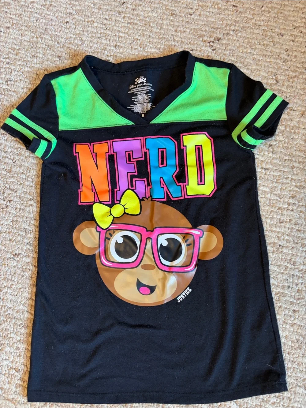 Justice Girls Black Tee with Neon Green Trim and Colorful NERD Graphic